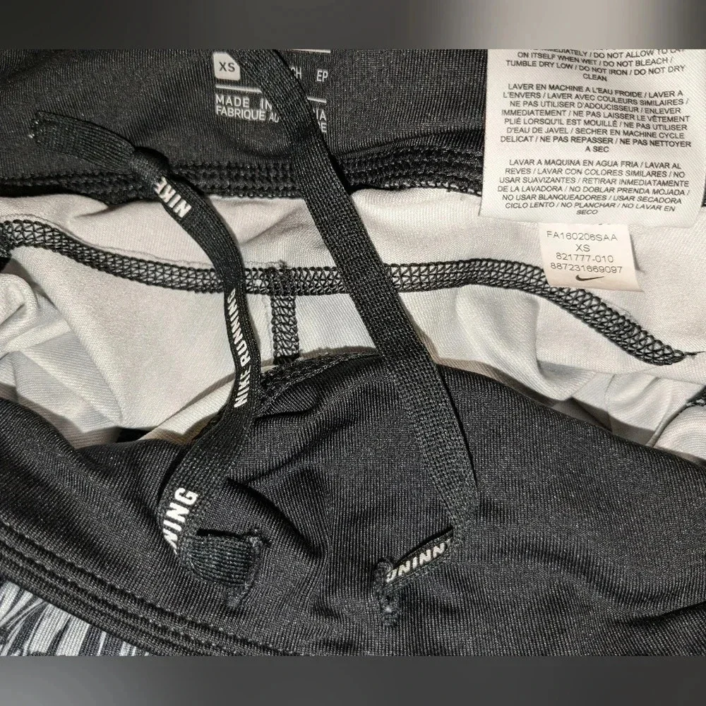Nike women's graphic DRI-FIT tight running Capri leggings, size XS , black/white